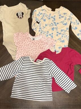 Mix of body suits and long sleeve shirts